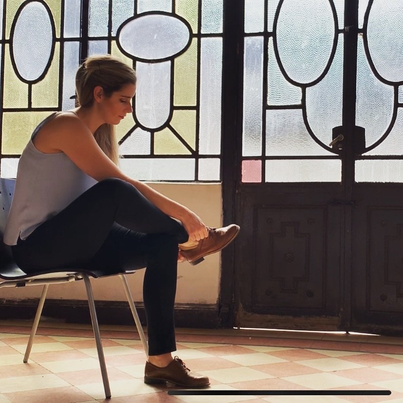 Women putting on her dance shoes