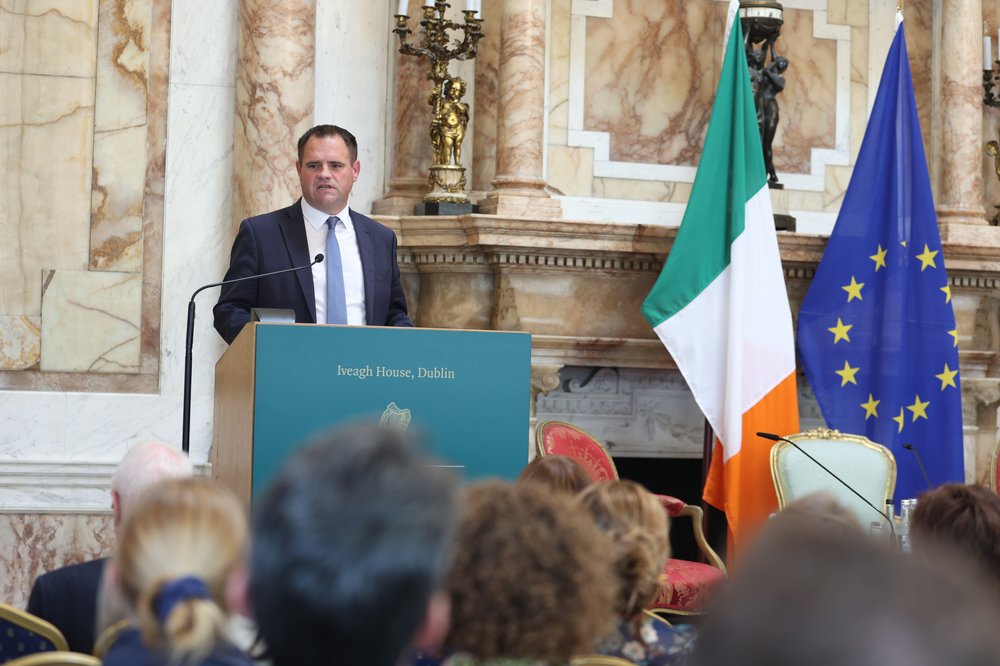 Minister Neale Richmond delivering opening remarks at the ballroom of Iveagh House for the launch of the 2025 Irish Aid Annual Report.
