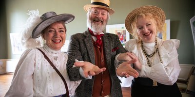 Three people in Bloomsday costume