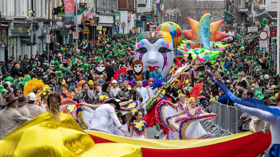 st patrick's day parade with people in colourful costume