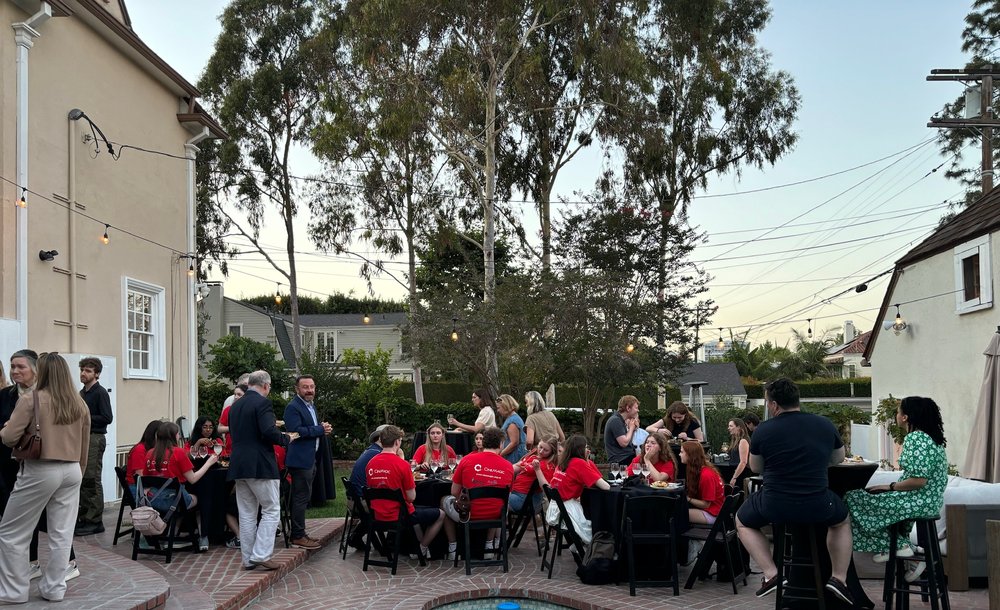 A group enjoying a reception in the garden at the Consul's residence in LA