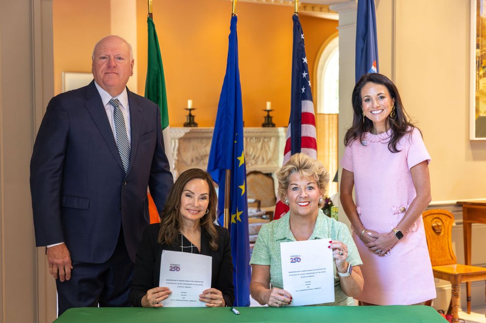 USA250 Chair Rosie Rios and Ambassador Geraldine Byrne Nason hold up MoU after signing