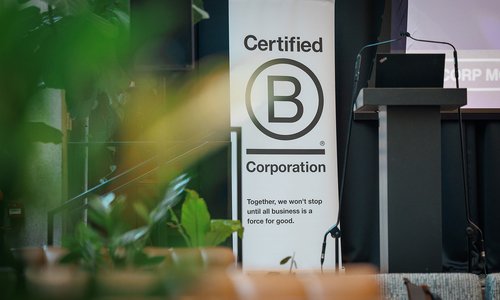 Sign reading "Certified B Corporation. Together we won't stop until all business is a force for good"