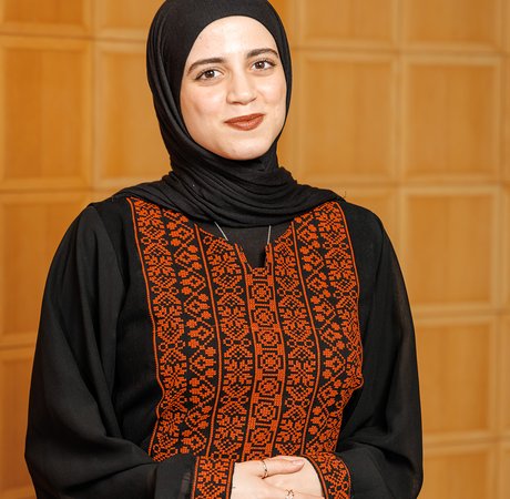 Woman in traditional muslim attire smiling