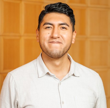 Man smiling wearing a white shirt