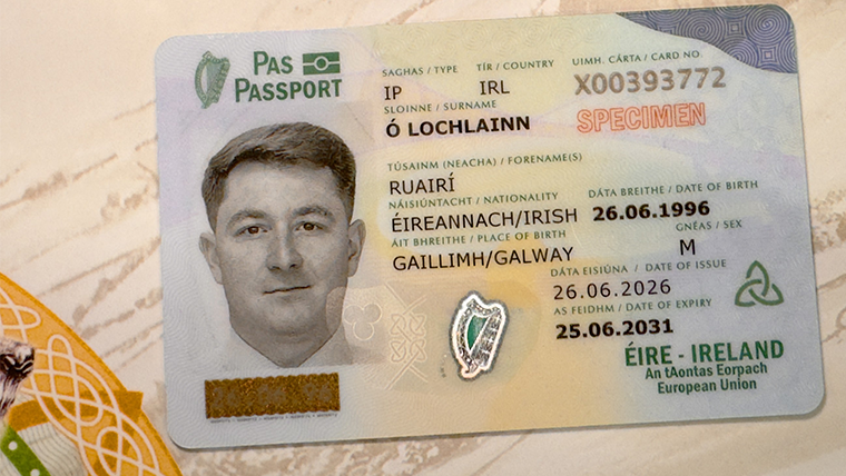 The 2026 Irish passport card in front of a graphic of an Irish landscape