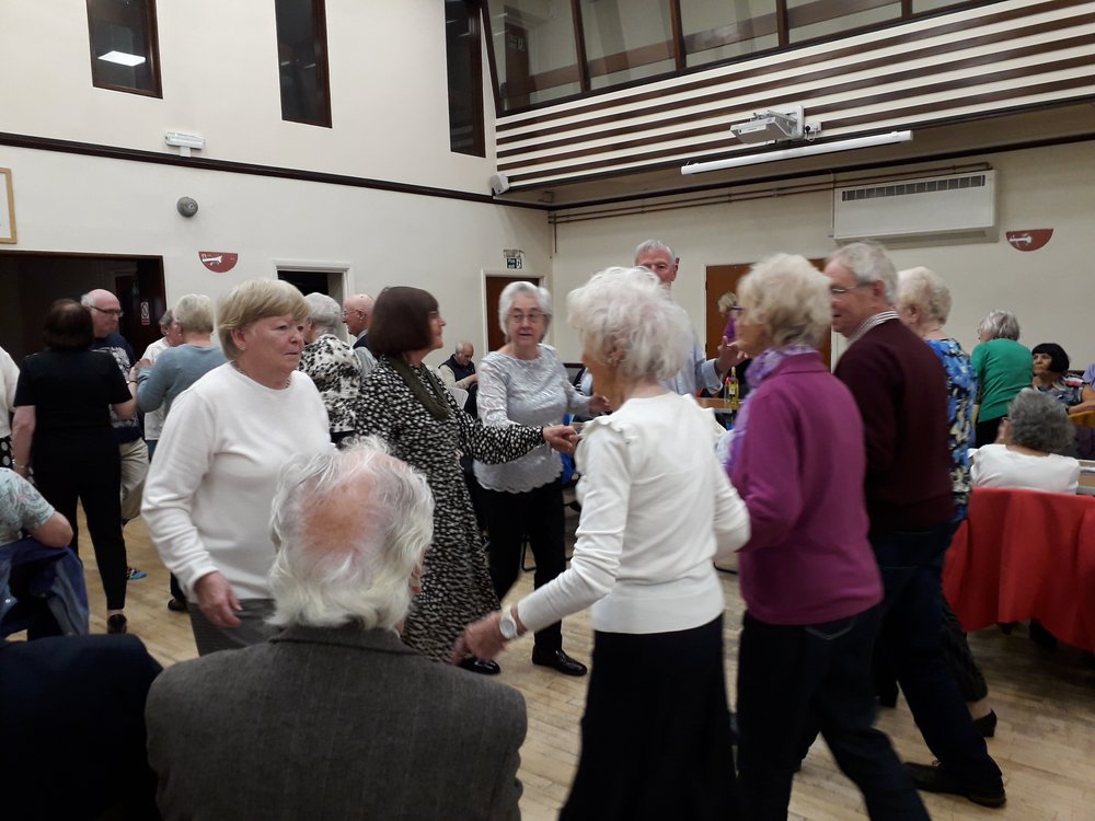 Older people learning to Irish dance.