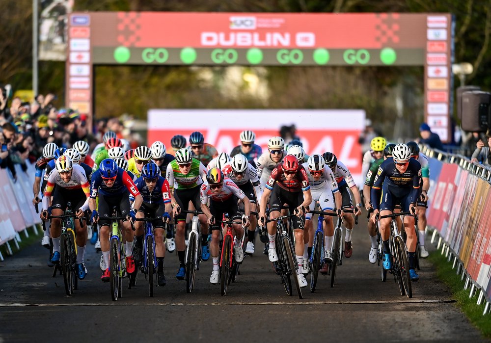 a large group of cyclists starting a race