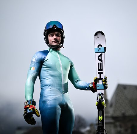 Cormac Comerford posing with his skis in Italy