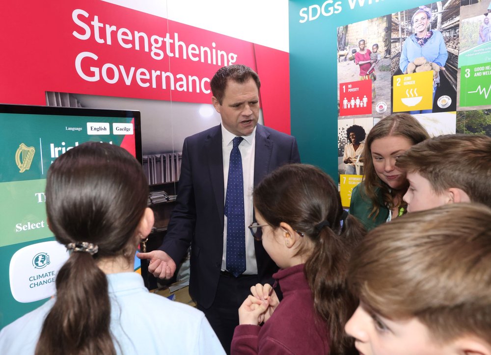 Minister Richmond with children at the Irish AID STAND AT Science Blast