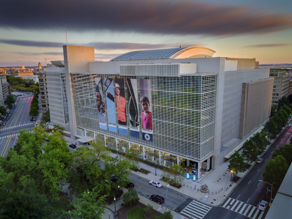 Exterior view of a large office building at dusk.