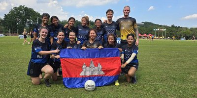 Group photo of Gaelic football team with Cambodia flag