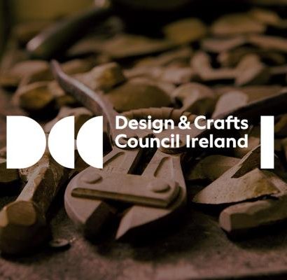 Design Craft Council Ireland logo on top of a picture of wooden shapes