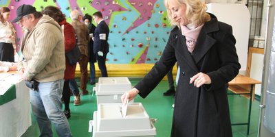 A voter casts her vote in Hungary's parliamentary elections