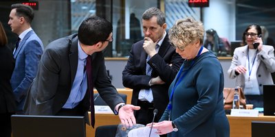Delegates sitting at their screens at the European Council.