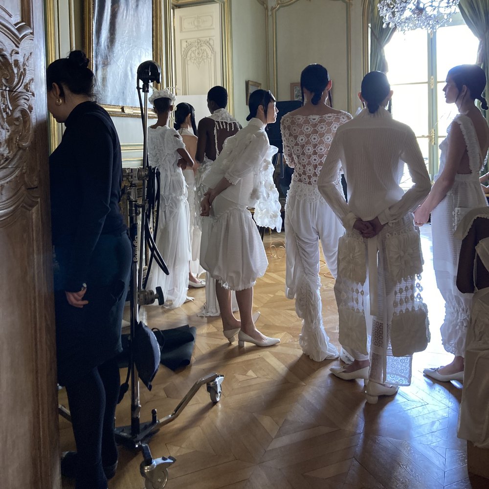 Models backstage in haute couture