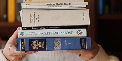 Someone holding a stack of literature