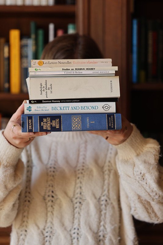 Image of a stack of books being held up