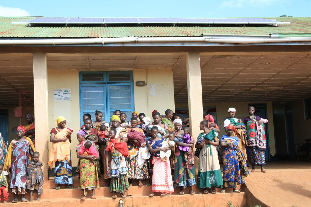 Mothers attending clinic services at Migongo Health Facility, which uses solar power to keep vital services running.