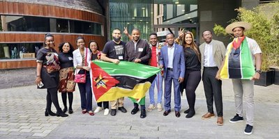 gang of people holding mozambique flag