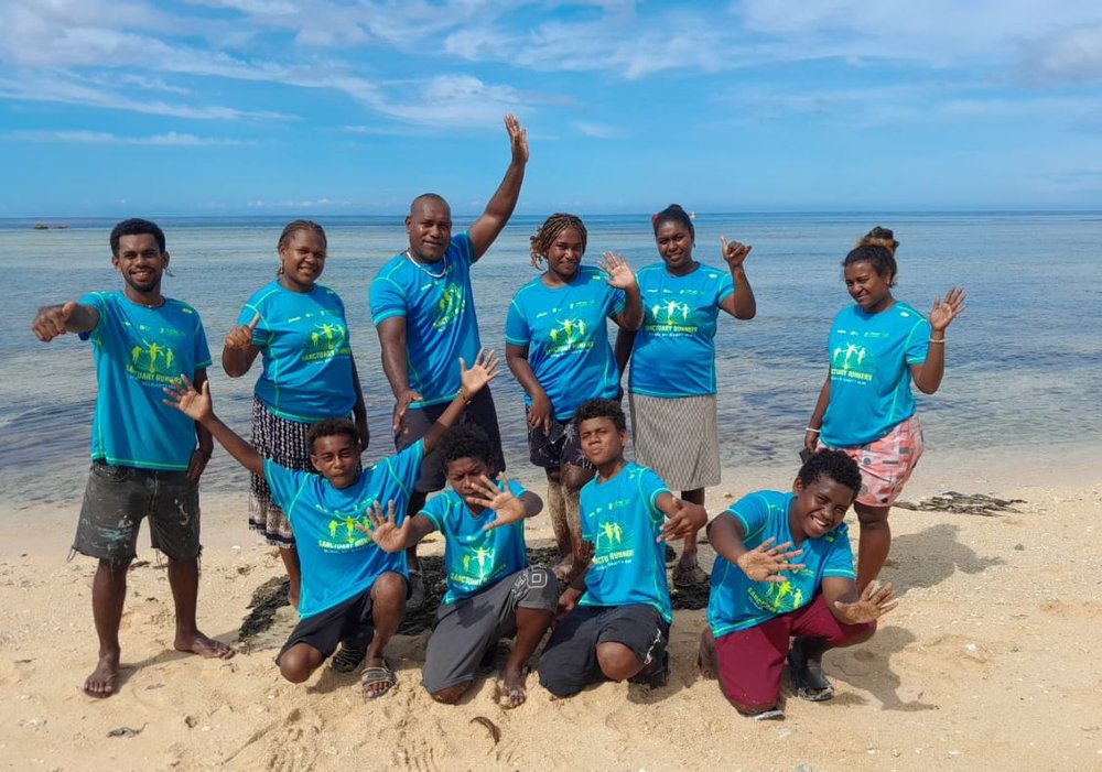 Runners by the beach in the Soloman islands