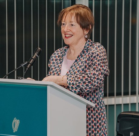 Women speaking at a podium