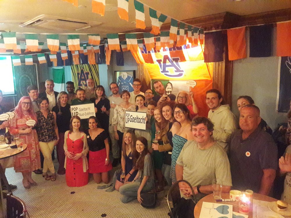 Group photo at a pop up Gaeltacht in a bar in New York