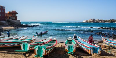 Colourful boats on the shoreline in Dakar.