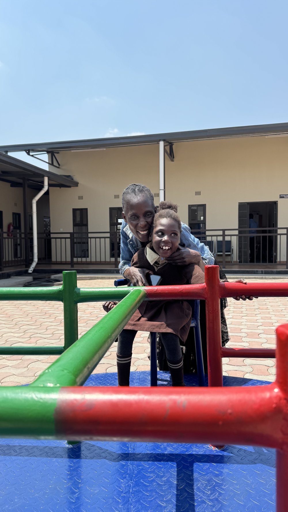 Woman playing with child in a playground