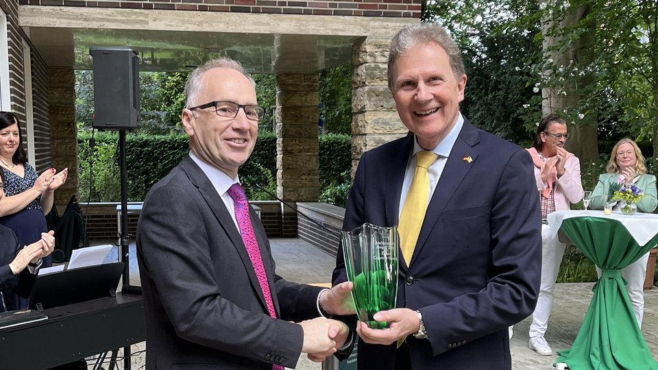 Amb O'Brien presents Amb Award to Elmar Conrads-Hassel