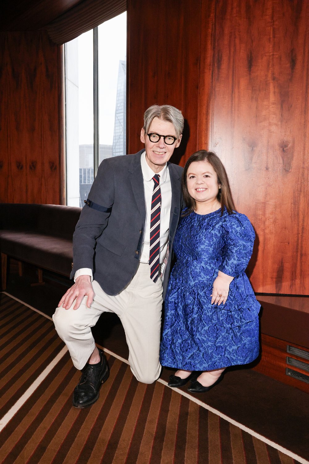 Andrew Bolton and Sinéad Burke posing for a photo together at the Costume Institute Pre-Met launch.