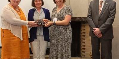 Anita Ormond, Michelle Kranjc and Laura Smith receiving the Bronze Shoes for the Hamilton Famine Way committee