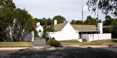View of the white Embassy building from the road.