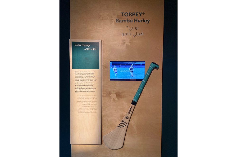 A hurl made from bamboo displayed on a wall.