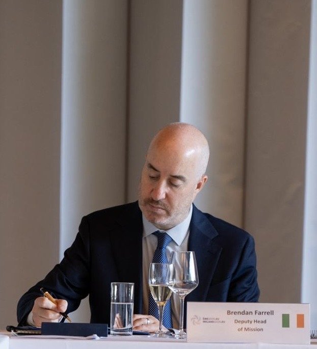 DHOM Brendan Farrell takes notes during a meeting