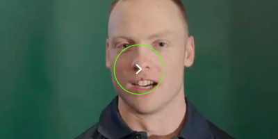 Headshot of Cormac Comerford with a play button overlay