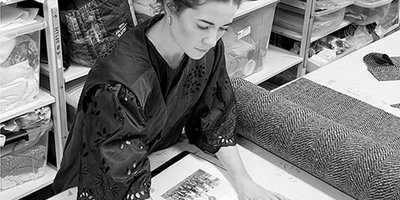 Woman working in an alterations studio