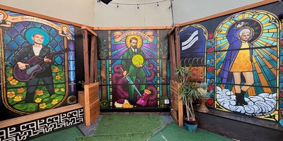 Group of people holding rainbow flags announcing the Honour Walk