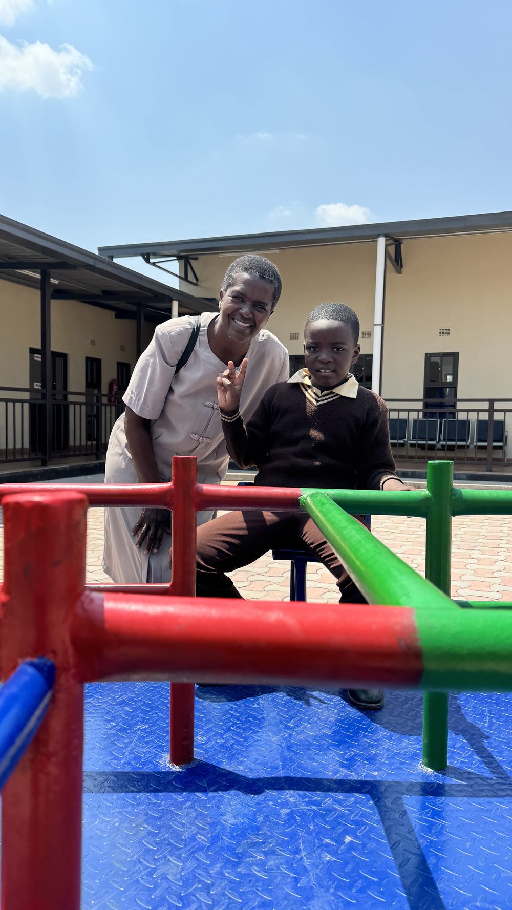 Woman playing with child in a playground