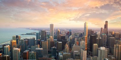Chicago's cityscape skyline with high rise buildings viewed at sunrise.