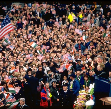 large crowd scene with american flags