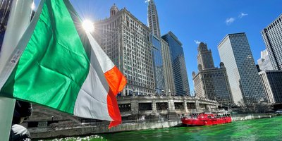 View of the Consulate office from the river which has been dyed green for St Patrick's Day.