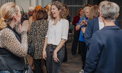 Woman laughing in the audience
