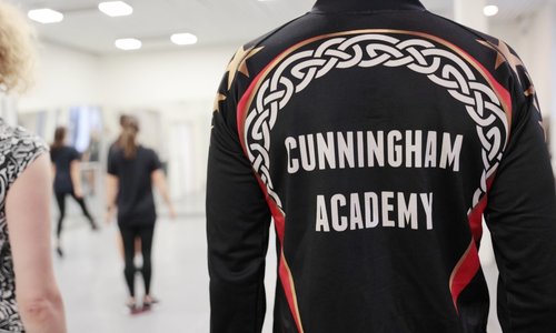 Back of a team jacket reading 'Cunningham Academy'