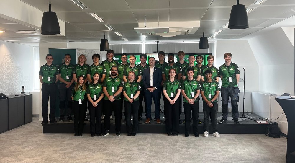 DCU Solar Racing team posing for a photo with Deputy Head of Mission David Walsh