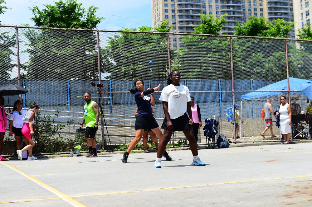 Tiffany Lau Wu engaging in a game in a park