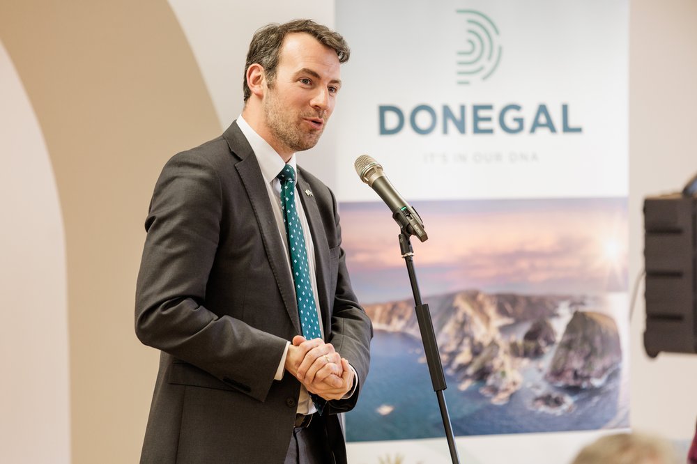 man standing talking into a mic