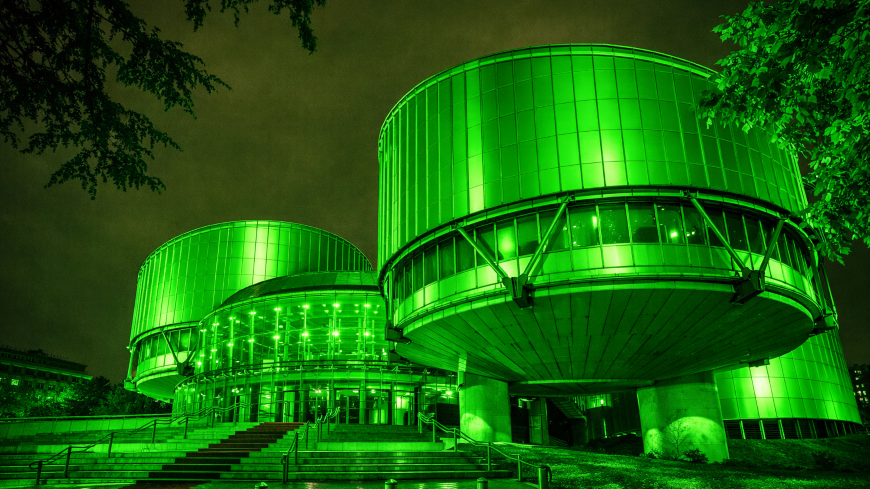 European Court of Human Rights building with green overlay