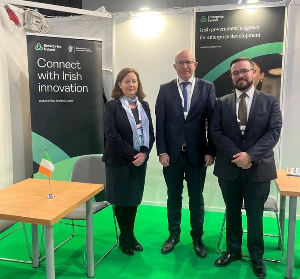 Three people at an Enterprise Ireland stand