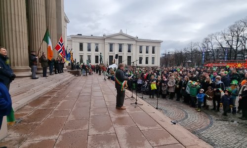 A man presenting to a large crowd